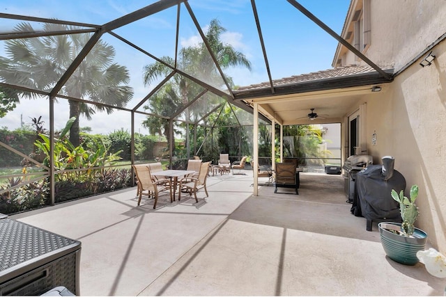 12358 Saint Simon Dr, Boca Raton, FL 33428 - view of patio featuring a ceiling fan, outdoor dining area, glass enclosure, and a grill