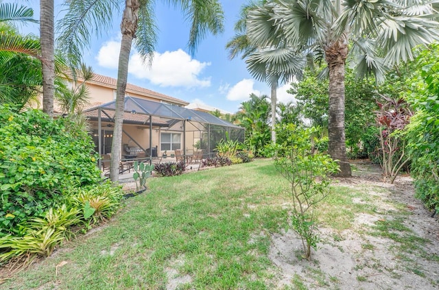 12358 Saint Simon Dr, Boca Raton, FL 33428 - view of grassy yard with a patio area and glass enclosure