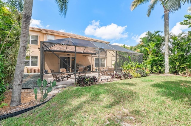 12358 Saint Simon Dr, Boca Raton, FL 33428 - rear view of property with stucco siding, a lawn, a patio area, a lanai, and ceiling fan