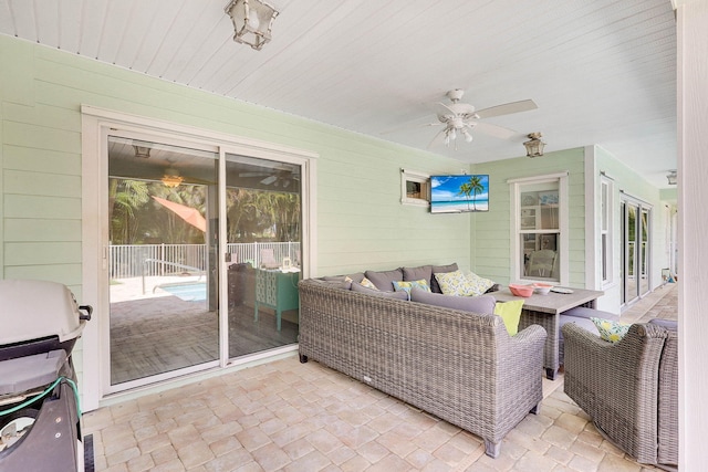 3824 SE Fairway E, Stuart, FL 34997 - sunroom featuring ceiling fan and an outdoor hangout area