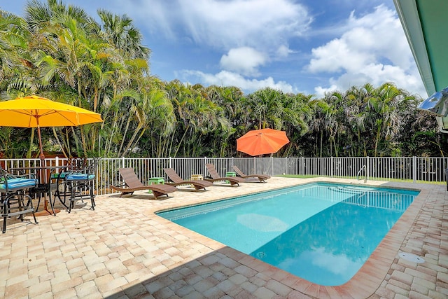 3824 SE Fairway E, Stuart, FL 34997 - view of swimming pool with a patio