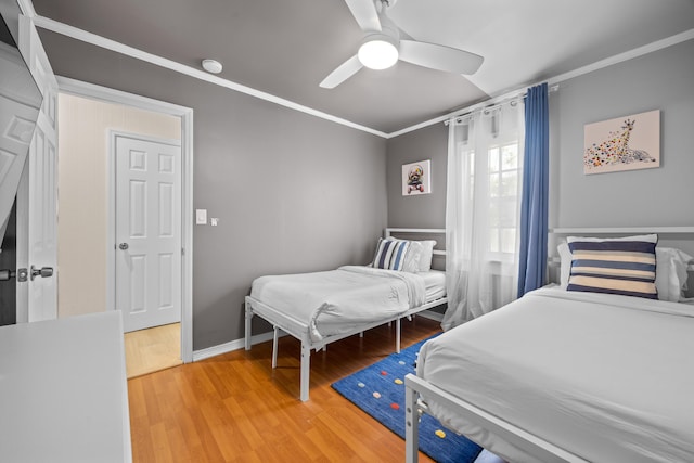 815 Green St, West Palm Beach, FL 33405 - bedroom with ornamental molding, light wood-type flooring, and ceiling fan