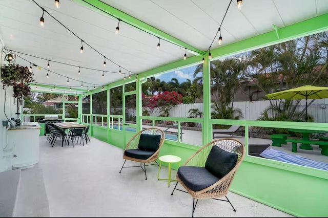 815 Green St, West Palm Beach, FL 33405 - sunroom featuring concrete floors and outdoor dining space