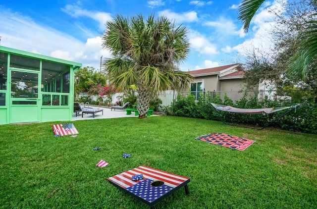 815 Green St, West Palm Beach, FL 33405 - view of yard with a sunroom and a patio