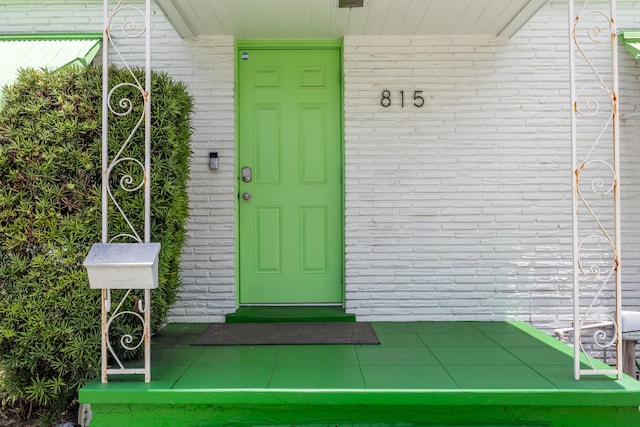 815 Green St, West Palm Beach, FL 33405 - property entrance featuring brick siding