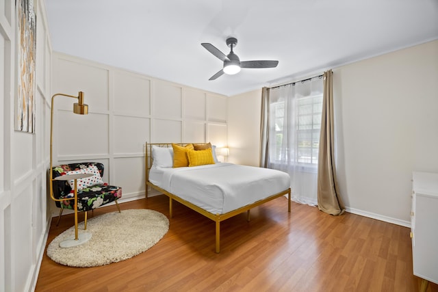 815 Green St, West Palm Beach, FL 33405 - bedroom with light wood finished floors and ceiling fan