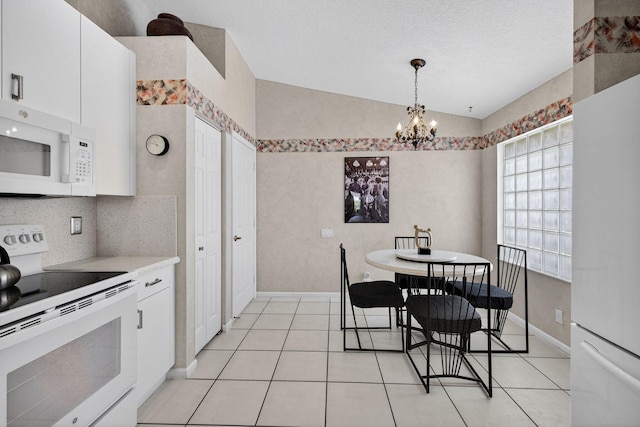 6679 Sherbrook Dr, Boynton Beach, FL 33437 - dining area with a chandelier, light tile patterned flooring, and lofted ceiling