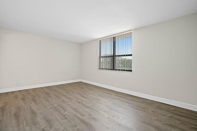 5480 N Ocean Dr Unit B1A, Singer Island, FL 33404 - unfurnished room with wood finished floors