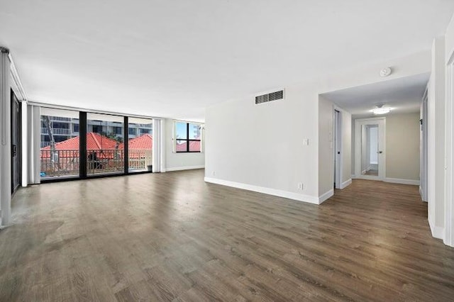 5480 N Ocean Dr Unit B1A, Singer Island, FL 33404 - empty room with wood finished floors