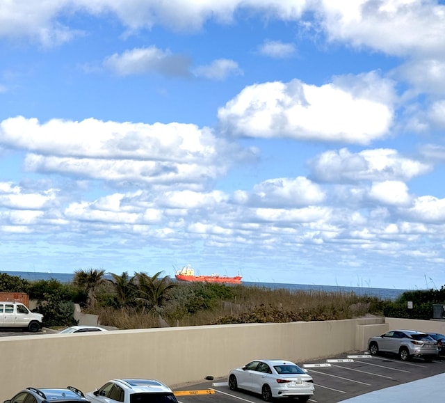5480 N Ocean Dr Unit B1A, Singer Island, FL 33404 - uncovered parking lot featuring a water view