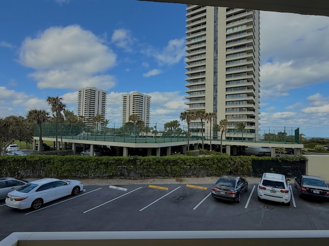 5480 N Ocean Dr Unit B1A, Singer Island, FL 33404 - view of building exterior with uncovered parking