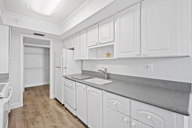 5480 N Ocean Dr Unit B1A, Singer Island, FL 33404 - kitchen featuring white appliances, light wood finished floors, white cabinetry, ornamental molding, and open shelves