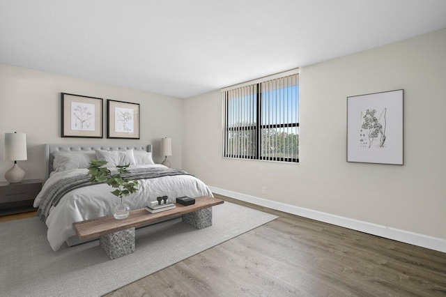 5480 N Ocean Dr Unit B1A, Singer Island, FL 33404 - bedroom featuring wood finished floors and baseboards