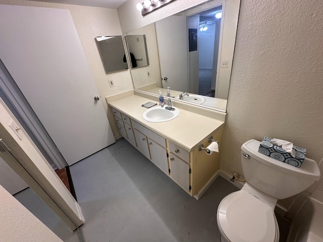 1401 Village Blvd Unit 1914, West Palm Beach, FL 33409 - half bathroom featuring a textured wall, vanity, and concrete floors