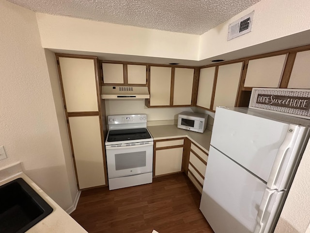 1401 Village Blvd Unit 1914, West Palm Beach, FL 33409 - kitchen with white appliances, under cabinet range hood, dark wood-style floors, a textured ceiling, and light countertops
