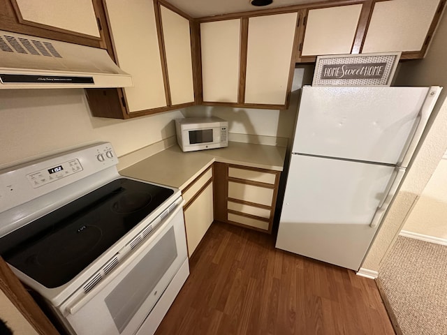 1401 Village Blvd Unit 1914, West Palm Beach, FL 33409 - kitchen featuring white appliances, under cabinet range hood, dark wood-style flooring, light countertops, and white cabinets