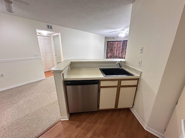 1401 Village Blvd Unit 1914, West Palm Beach, FL 33409 - kitchen featuring stainless steel dishwasher, ceiling fan, light countertops, a textured ceiling, and wood finished floors