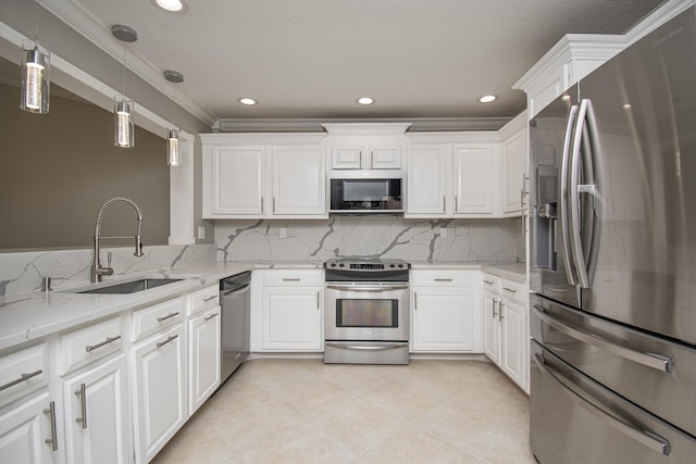 21734 San Simeon Cir, Boca Raton, FL 33433 - kitchen with stainless steel appliances, white cabinets, backsplash, crown molding, and hanging light fixtures