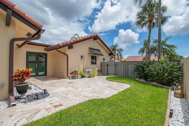 21734 San Simeon Cir, Boca Raton, FL 33433 - view of yard with french doors, a gate, and a patio