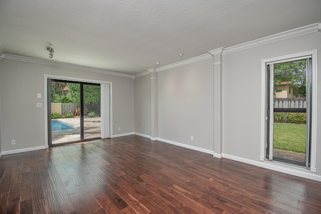 21734 San Simeon Cir, Boca Raton, FL 33433 - spare room featuring healthy amount of natural light, crown molding, dark wood-type flooring, decorative columns, and a textured ceiling