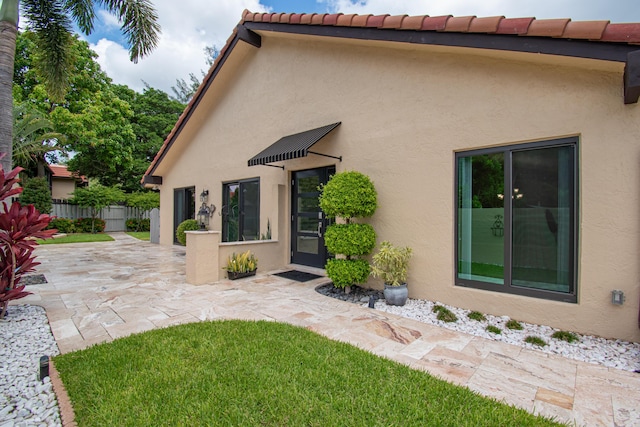 21734 San Simeon Cir, Boca Raton, FL 33433 - back of property featuring a patio area and stucco siding