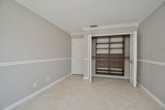21734 San Simeon Cir, Boca Raton, FL 33433 - unfurnished bedroom with ornamental molding, light tile patterned floors, a closet, and a textured ceiling