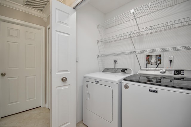21734 San Simeon Cir, Boca Raton, FL 33433 - laundry area featuring independent washer and dryer, ornamental molding, and light tile patterned flooring