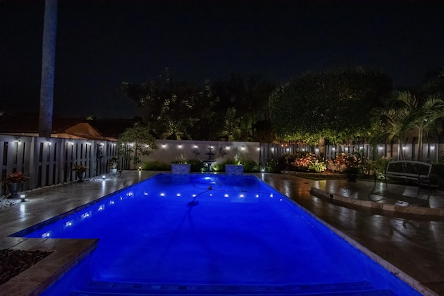21734 San Simeon Cir, Boca Raton, FL 33433 - pool at twilight featuring a fenced backyard