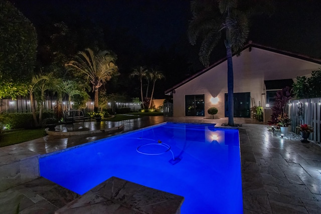 21734 San Simeon Cir, Boca Raton, FL 33433 - pool at twilight featuring a patio area and an outdoor pool