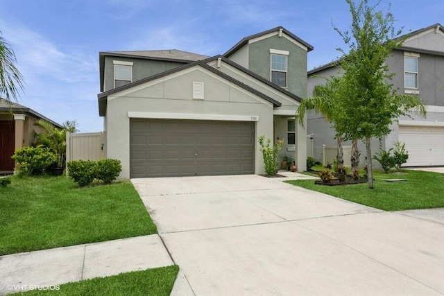 5126 Dandelion St, Apollo Beach, FL 33572 - traditional home featuring stucco siding, driveway, and a front lawn