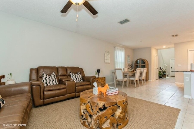 5126 Dandelion St, Apollo Beach, FL 33572 - living area with light tile patterned floors and a ceiling fan