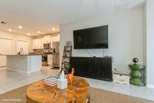 5126 Dandelion St, Apollo Beach, FL 33572 - living room featuring light tile patterned flooring and recessed lighting