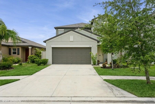 5126 Dandelion St, Apollo Beach, FL 33572 - view of front facade with concrete driveway, stucco siding, an attached garage, and a front yard