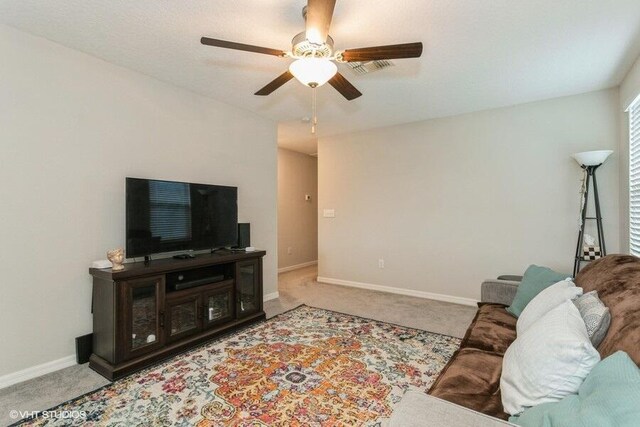 5126 Dandelion St, Apollo Beach, FL 33572 - carpeted living area with a ceiling fan and baseboards