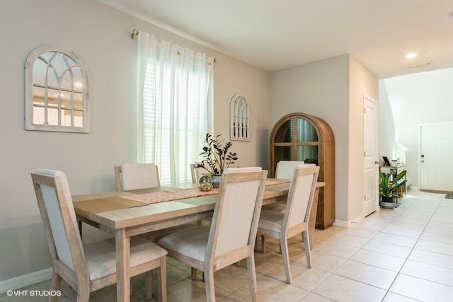 5126 Dandelion St, Apollo Beach, FL 33572 - dining area with light tile patterned floors and baseboards