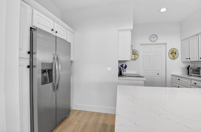 19349 Sabal Lake Dr Unit 5046, Boca Raton, FL 33434 - kitchen with stainless steel refrigerator with ice dispenser, light wood-style floors, white cabinetry, light stone countertops, and recessed lighting