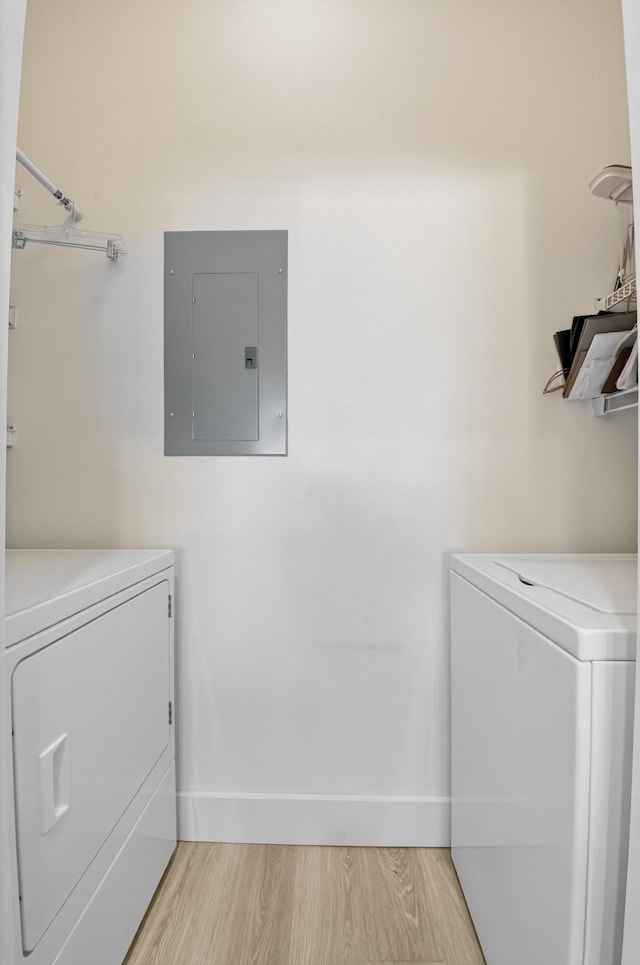 19349 Sabal Lake Dr Unit 5046, Boca Raton, FL 33434 - laundry room featuring electric panel, washing machine and clothes dryer, and light wood-type flooring