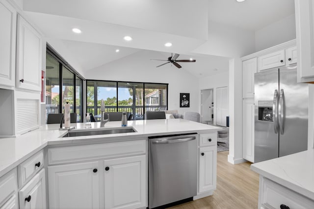19349 Sabal Lake Dr Unit 5046, Boca Raton, FL 33434 - kitchen featuring stainless steel appliances, recessed lighting, ceiling fan, white cabinetry, and a peninsula