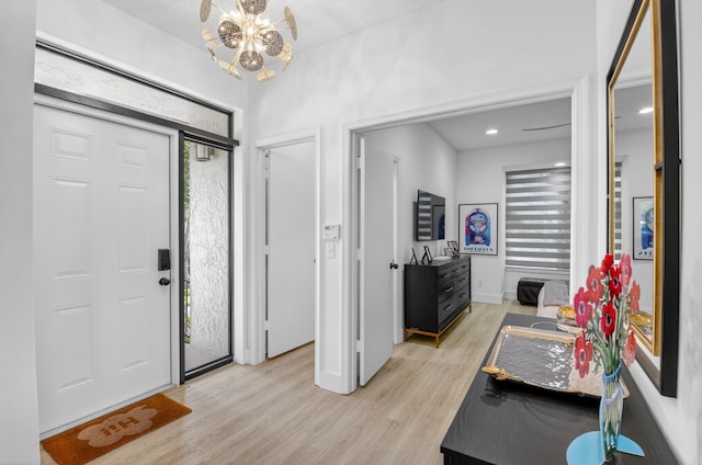19349 Sabal Lake Dr Unit 5046, Boca Raton, FL 33434 - entrance foyer featuring a chandelier, light wood-style flooring, and healthy amount of natural light