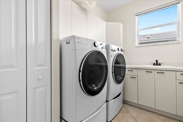 9222 Delemar Ct, Wellington, FL 33414 - washroom with separate washer and dryer, cabinet space, and light tile patterned floors