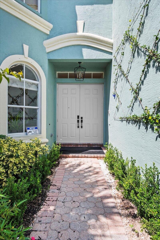 9222 Delemar Ct, Wellington, FL 33414 - doorway to property with stucco siding