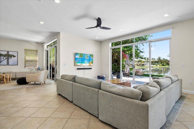 9222 Delemar Ct, Wellington, FL 33414 - living area with light tile patterned floors, recessed lighting, a ceiling fan, and a textured ceiling