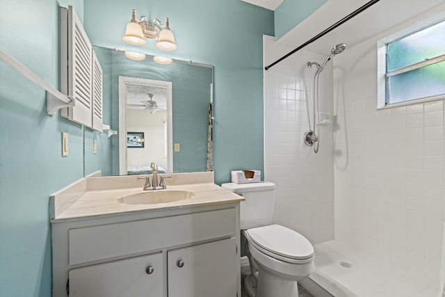 849 SE Celtic Ave, Port Saint Lucie, FL 34983 - bathroom featuring a ceiling fan, vanity, and tiled shower