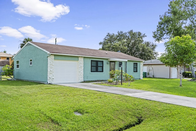 849 SE Celtic Ave, Port Saint Lucie, FL 34983 - ranch-style home with driveway, an attached garage, a front lawn, stone siding, and stucco siding