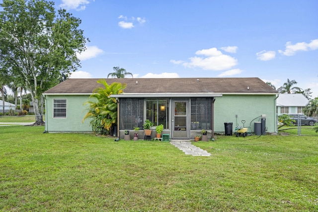 849 SE Celtic Ave, Port Saint Lucie, FL 34983 - back of property featuring a sunroom and stucco siding