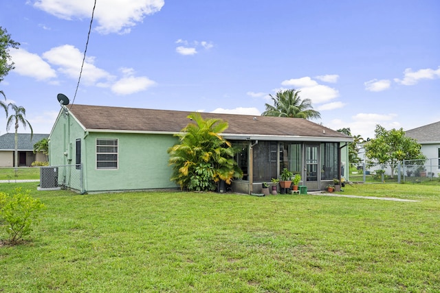 849 SE Celtic Ave, Port Saint Lucie, FL 34983 - rear view of property with a sunroom, stucco siding, and a shingled roof