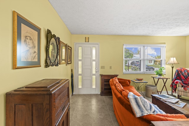 849 SE Celtic Ave, Port Saint Lucie, FL 34983 - foyer featuring a textured ceiling and dark tile patterned floors