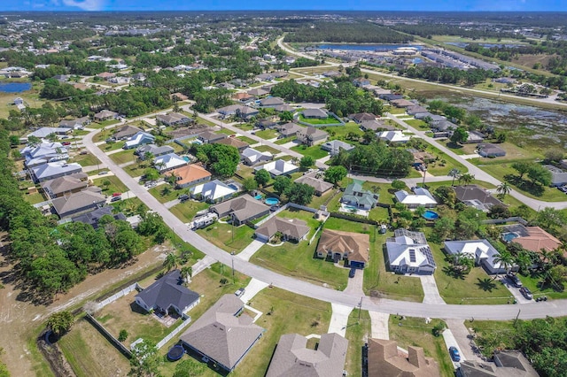 5533 NW Cordrey St, Port Saint Lucie, FL 34986 - aerial view of property's location featuring nearby suburban area and a large body of water