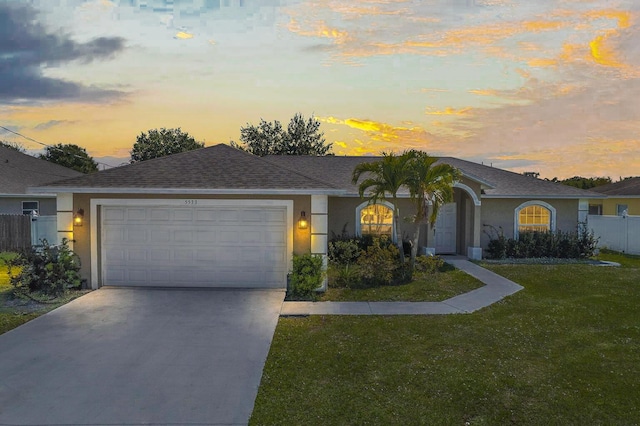 5533 NW Cordrey St, Port Saint Lucie, FL 34986 - ranch-style house featuring stucco siding, a garage, driveway, and a shingled roof