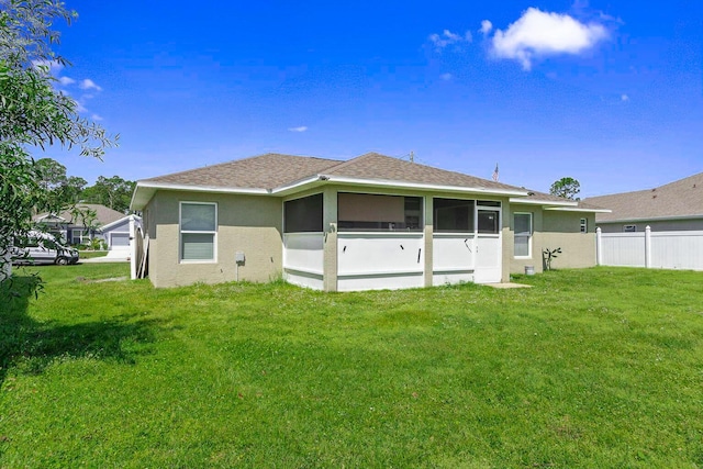 5533 NW Cordrey St, Port Saint Lucie, FL 34986 - back of house with a sunroom, stucco siding, and a shingled roof